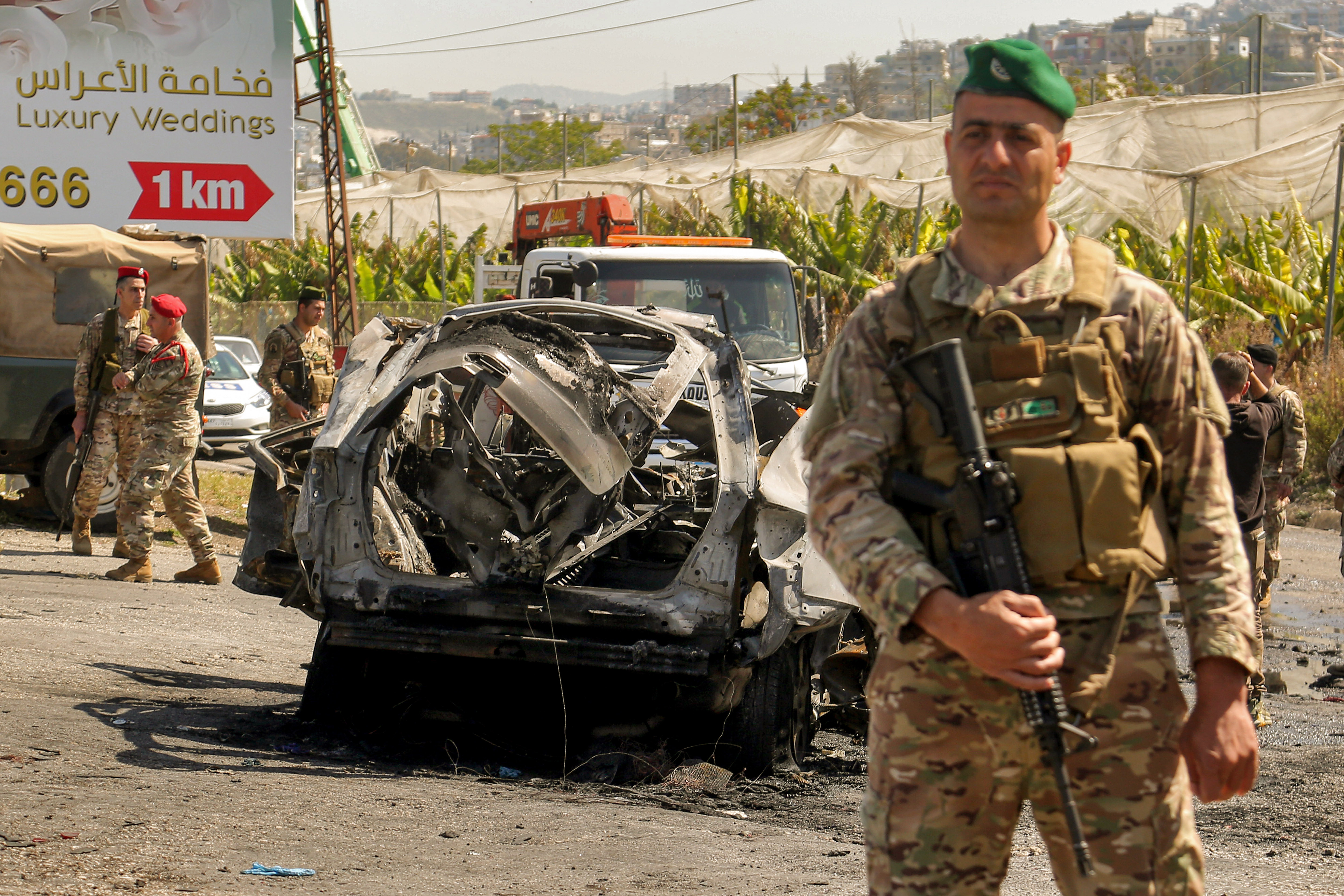 Lebanese soldiers secure the area where a SUV reportedly hit by an Israeli strike in Ghaziyeh, near the southern port city Sidon.
Reuters