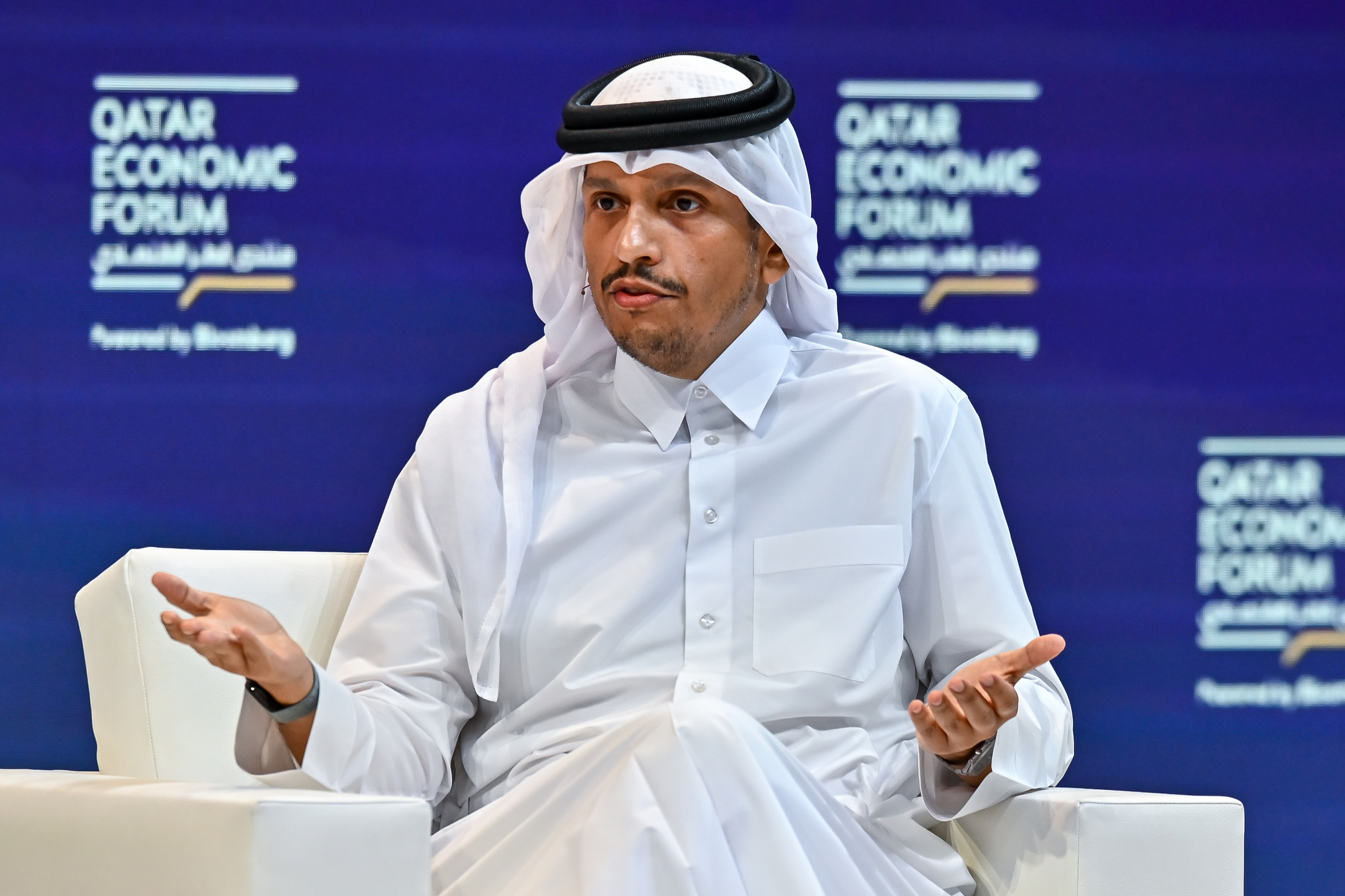Qatari Prime Minister Mohammed bin Abdulrahman Al-Thani speaks with host Joumanna Bercetche during the opening session of the Qatar Economic Forum 2025 in Doha, Qatar, on May 20, 2025. (Photo by Noushad Thekkayilvia Reuters)