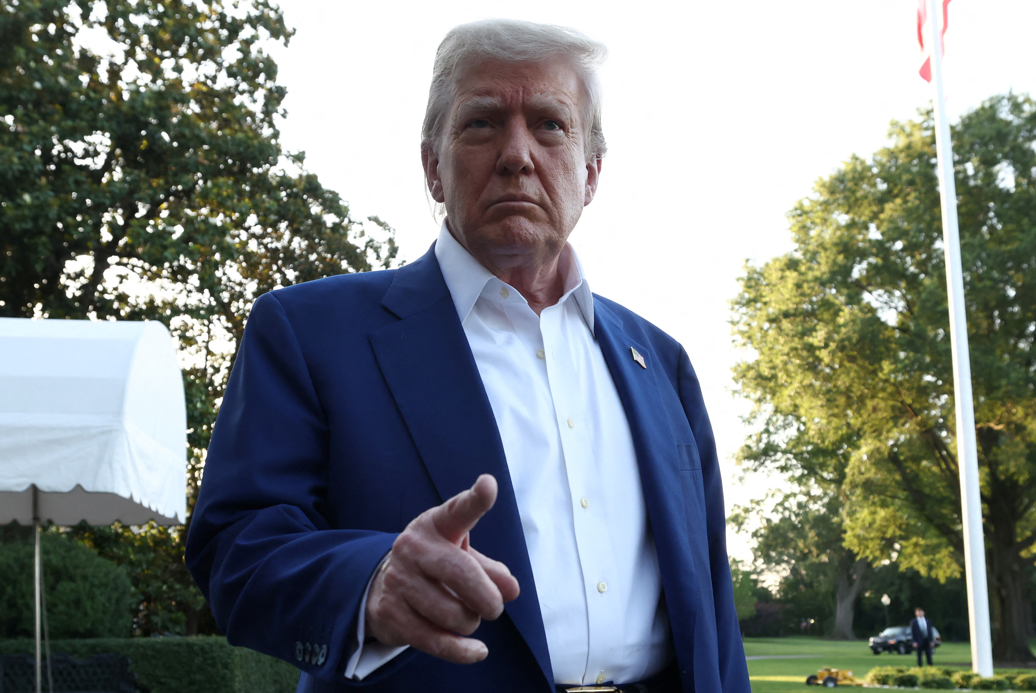 U.S. President Donald Trump speaks to media ahead of boarding Marine One to depart to attend the NATO Summit in The Hague, Netherlands, from the South Lawn at the White House in Washington, D.C., U.S., June 24, 2025. REUTERS/Kevin Lamarque