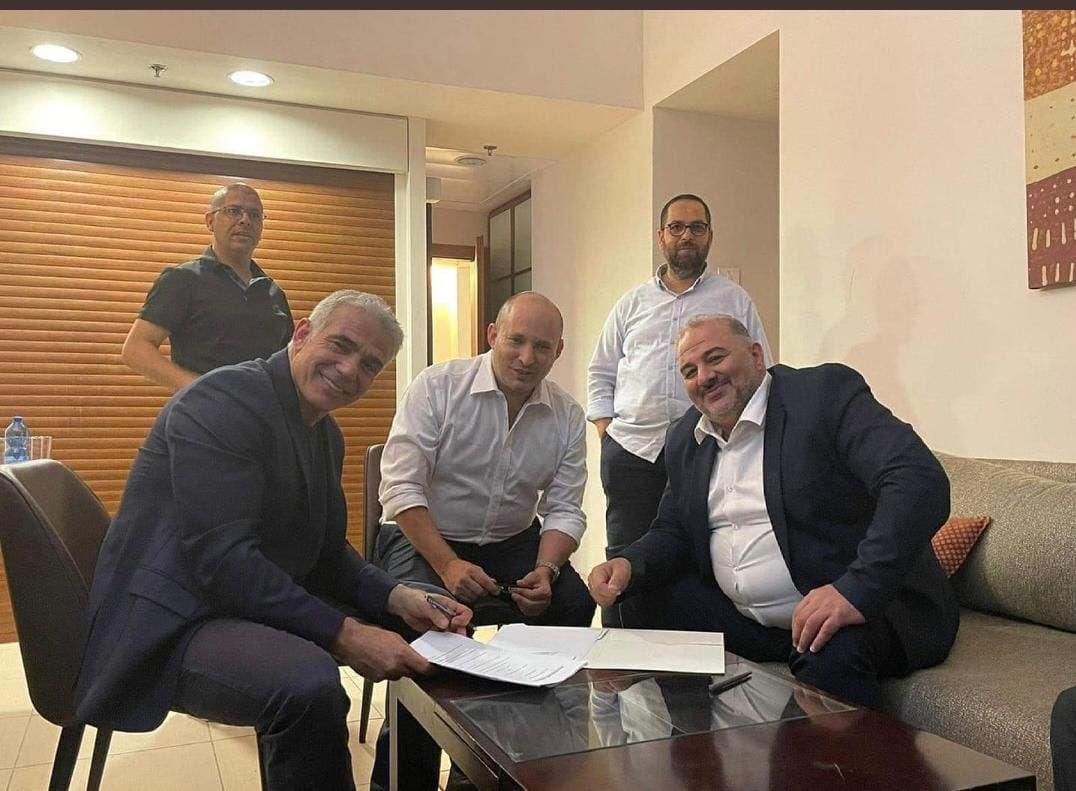 Yesh Atid party leader Yair Lapid, Yamina party leader Naftali Bennett and Ra'am head Mansour Abbas