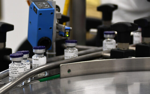 Vials of a potential coronavirus vaccine are seen on an assembly line in a photograph released by Israel's Institute for Biological Research, October 25, 2020. (Photo: Israeli Ministry of Defense)