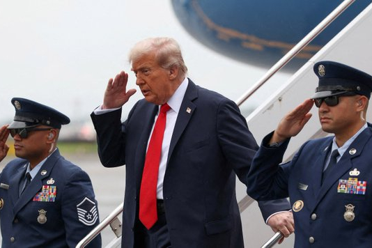 US President Donald Trump standing with US military. September 8 2025 Photo: (Photo used under section 27A of the copyright law).