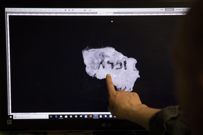 maging technician and camera operator, Shay Halevy, shows on screen fragments of a newly discovered script found by Israel Antiquities Authority researcher, Oren Abelman, in 