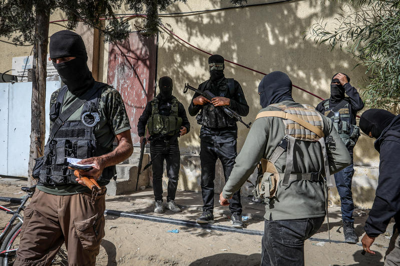 Masked members of the Palestinian Hamas movement arrest several members of Yasser Abu Shabab, who are accused of collaborating with the Israeli army in the Gaza Strip, according to Hamas members, in the southern Gaza Strip. Photo by Saeed Mohammed/Flash90.