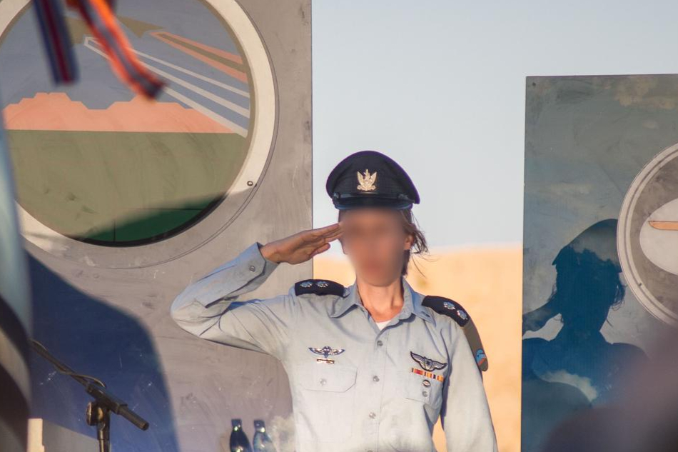 Illustration: Lt. Col. G., the first female commander of Nachshon Squadron, salutes during her appointment as commander of an operational base in the Israeli Air Force, March 2024. (Photo: IDF)